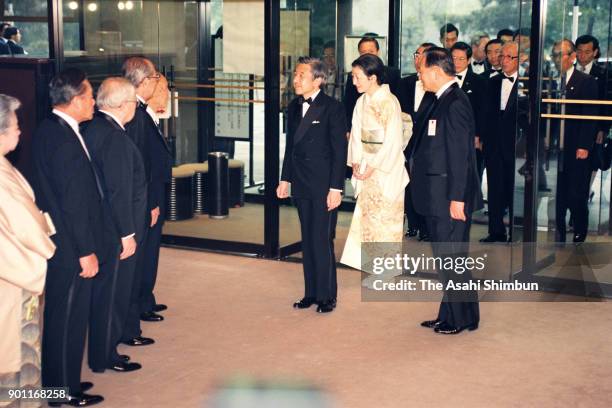 Emperor Akihito and Empress Michiko are seen on arrival at the National Theatre to attend the Japan Prize Award Ceremony on April 25, 1991 in Tokyo,...