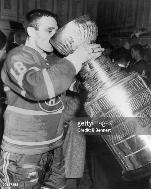 Marcel Bonin of the Montreal Canadiens drinks from the Stanley Cup following his team's victory over the Toronto Maple Leafs in the 1959 Stanley Cup...