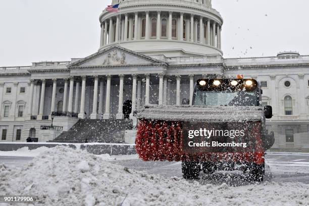 Bobcat Co. Machine clears snow near the U.S. Capitol in Washington, D.C., U.S., on Thursday, Jan. 4, 2018. A fast-moving winter storm, growing...