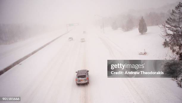 Commuters drive on the Sunrise Highway as a blizzard hits the Northeastern part of the United States on January 4, 2018 in Medford, New York.