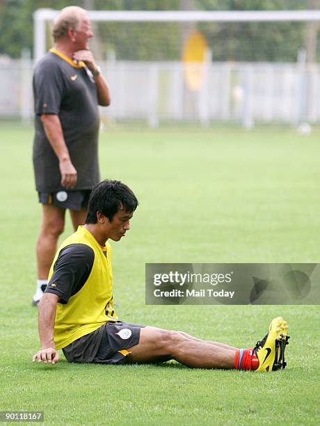 Indian football team captain Baichung Bhutia practices with coach Bob Houghton in New Delhi ahead of their match with Sri Lanka at the Nehru Cup...