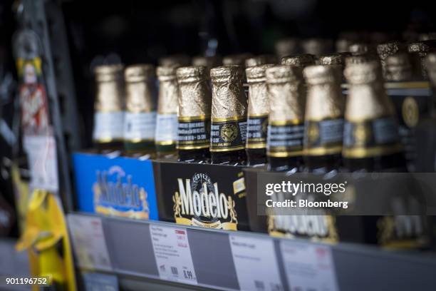 Bottles of Constellation Brands Inc. Modelo beer sit on display for sale inside a BevMo Holdings LLC store in Walnut Creek, California, U.S., on...