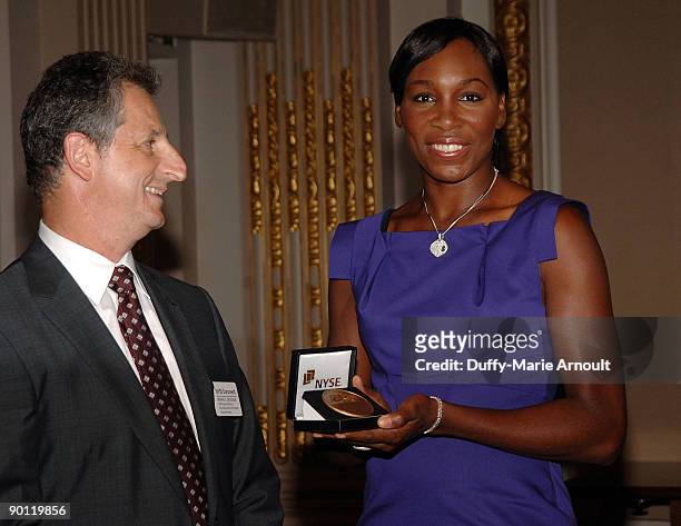 And executive vice president of NYSE Michael Geltzeiler and tennis player Venus Williams visit the New York Stock Exchange on August 27, 2009 in New...