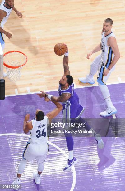 Willie Cauley-Stein of the Sacramento Kings goes up for the shot against Brandan Wright of the Memphis Grizzlies on December 31, 2017 at Golden 1...