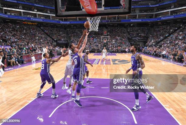 Brandan Wright of the Memphis Grizzlies rebounds against Bogdan Bogdanovic of the Sacramento Kings on December 31, 2017 at Golden 1 Center in...