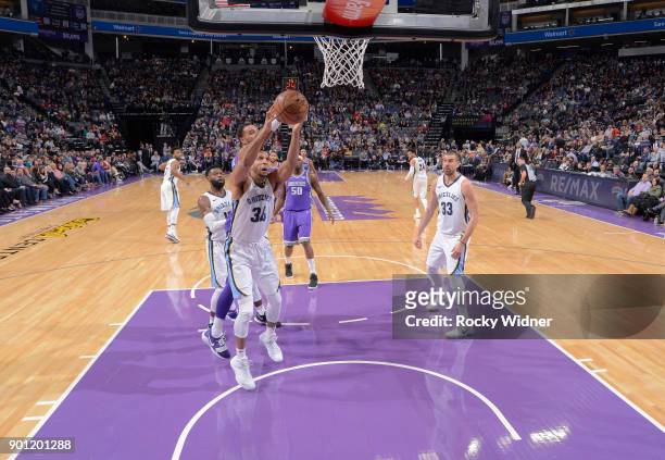Brandan Wright of the Memphis Grizzlies rebounds against the Sacramento Kings on December 31, 2017 at Golden 1 Center in Sacramento, California. NOTE...