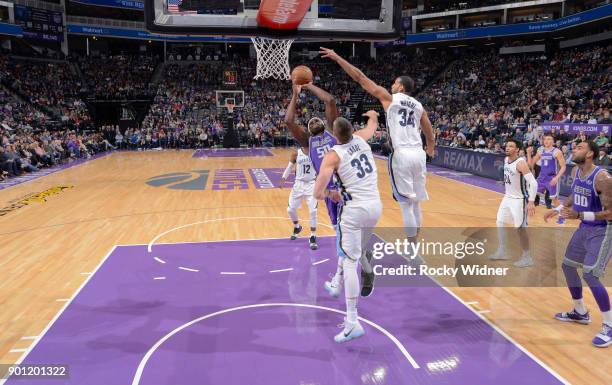 Zach Randolph of the Sacramento Kings puts up a shot against Marc Gasol and Brandan Wright of the Memphis Grizzlies on December 31, 2017 at Golden 1...