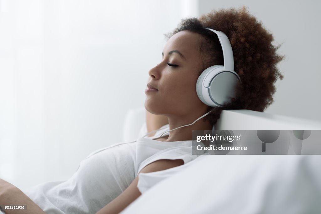 Woman relaxing and listening to music