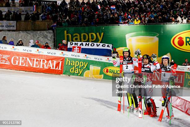 Mario Matt of Austria takes 2nd place, Marcel Hirscher of Austria takes 1st place, Henrik Kristoffersen of Norway takes 3rd place during the Audi FIS...