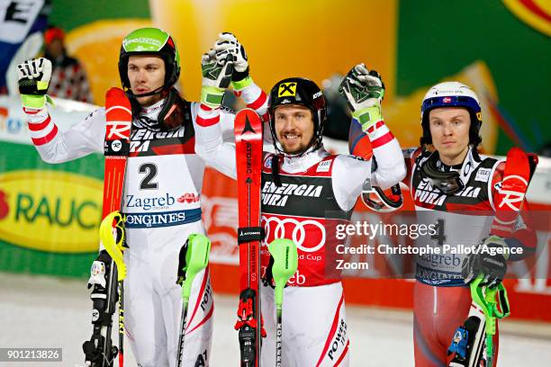 Mario Matt of Austria takes 2nd place, Marcel Hirscher of Austria takes 1st place, Henrik Kristoffersen of Norway takes 3rd place during the Audi FIS...