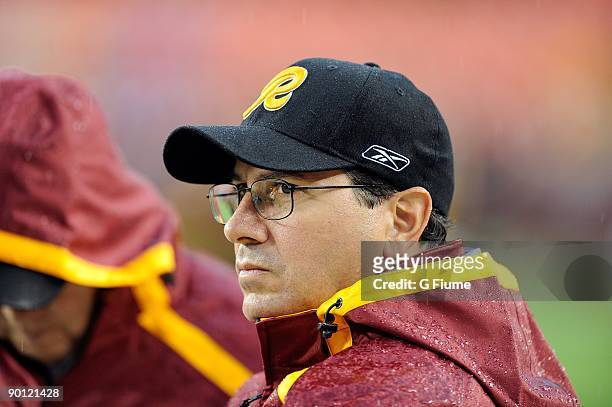 Owner Daniel Snyder of the Washington Redskins watches warm-ups before the game against the Pittsburgh Steelers at Fed Ex Field on August 22, 2009 in...