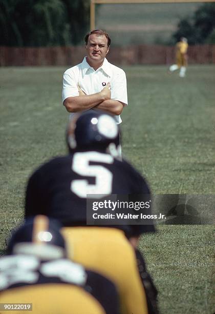 Pittsburgh Steelers coach Chuck Noll watching QB Terry Hanratty during training camp at St. Vincent College. Latrobe, PA 7/29/1973 CREDIT: Walter...