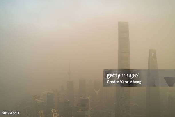 shanghai city in heavy pollution day - pollution smog stock pictures, royalty-free photos & images