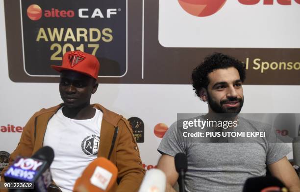 African Player of the Year Award nominees, Liverpool's Senegalese striker Sadio Mane and Liverpool's Egyptian striker Mohamed Salah , attend a media...