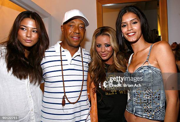 Model Jessica Gomes, Russell Simmons, singer Aubrey O'Day, and model Jaslene Gonzalez attends the launch of the Dare To Love line from Heart On My...