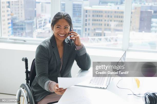 businesswoman with disability - filipino stock pictures, royalty-free photos & images