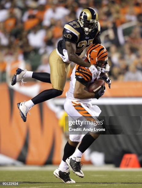 Tight end J. P. Foschi of the Cincinnati Bengals runs after the catch against David Roach of the St. Louis Rams during the preseason game at Paul...
