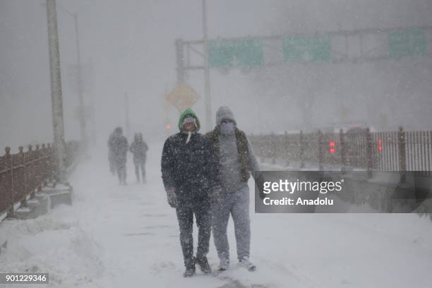 People make their way during a winter storm in Brooklyn borough of New York, United States on January 04, 2018.