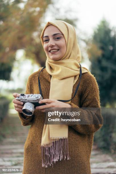 Young muslim woman photographer