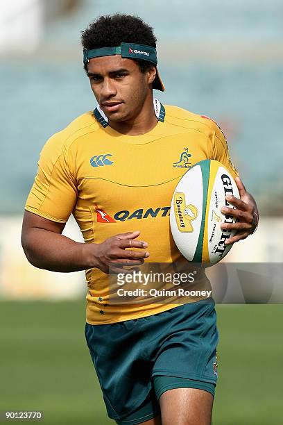 Will Genia of the Wallabies runs with the ball during the Australian Wallabies captain's run at Subiaco Oval on August 28, 2009 in Perth, Australia.