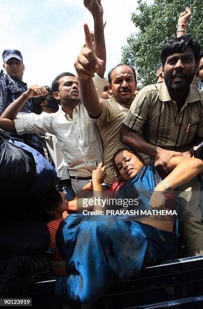Nepalese police detain supporters of Vice President Parmananda Jha as they stage a demonstration in front of the Supreme Court in Kathmandu on August...