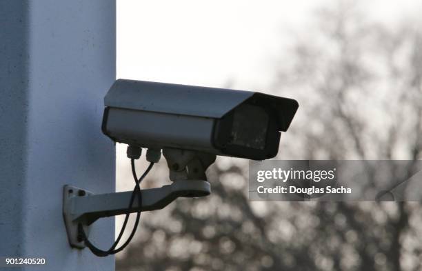 surveillance camera mounted on a pole - surveillance screen stock pictures, royalty-free photos & images