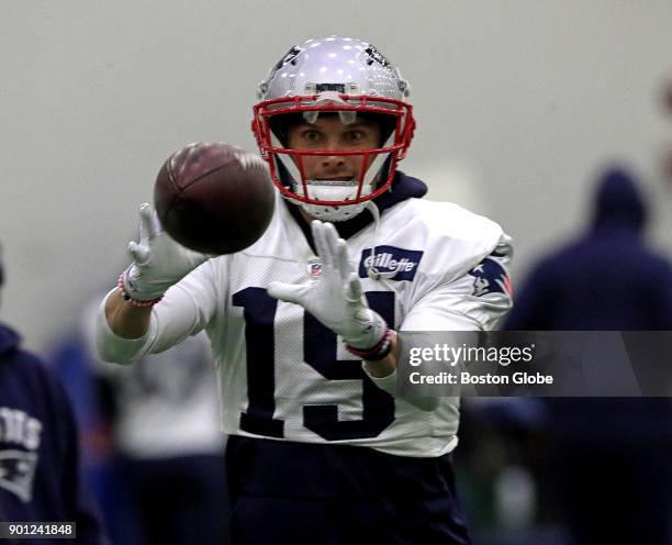 New England Patriots wide receiver Chris Hogan pulls in a pass during practice in Foxborough, Mass., on Jan. 4, 2018. A snow storm moved the day's...