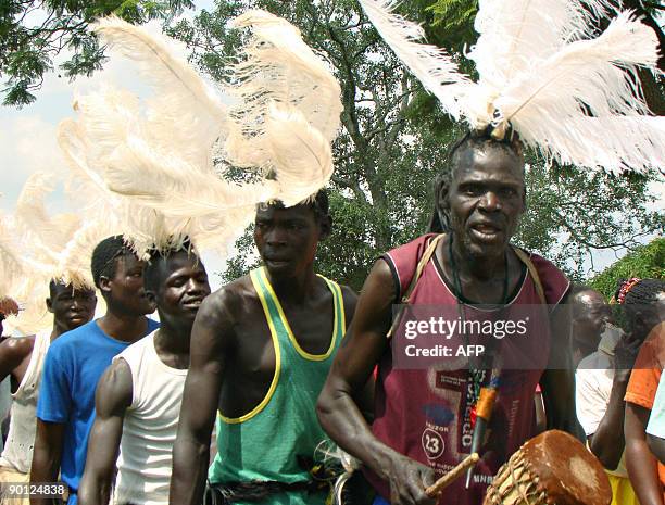 Villagers from Amoyo Koma dance during a burial ceremony on July 9, 2009 for the remains of a woman who was a victim of attacks of rebels from the...