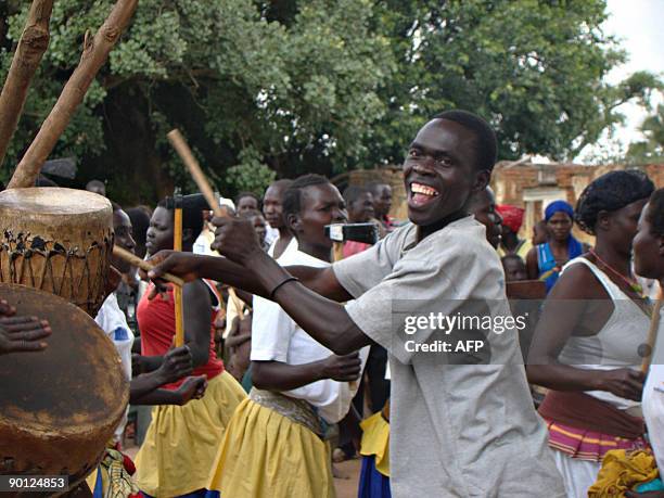 Villagers from Amoyo Koma dance during a burial ceremony on July 9, 2009 for the remains of a woman who was a victim of attacks of rebels from the...