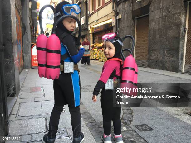 two brothers dressed as divers - neoprene fotografías e imágenes de stock