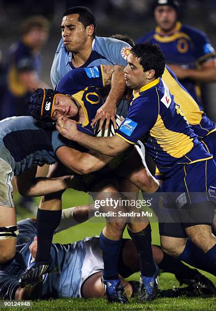 Hoani Matenga of Otago is tackled during the Air New Zealand Cup match between Northland and Otago at Okara Park on August 28, 2009 in Whangarei, New...