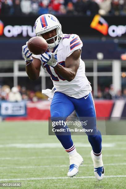 Deonte Thompson of the Buffalo Bills makes a reception against the New England Patriots at Gillette Stadium on December 24, 2017 in Foxboro,...