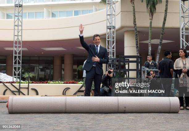 Host Seth Meyers rolls out the red carpet during the 75th Annual Golden Globe Awards Preview Day at the Beverly Hilton Hotel on January 4 in Beverly...