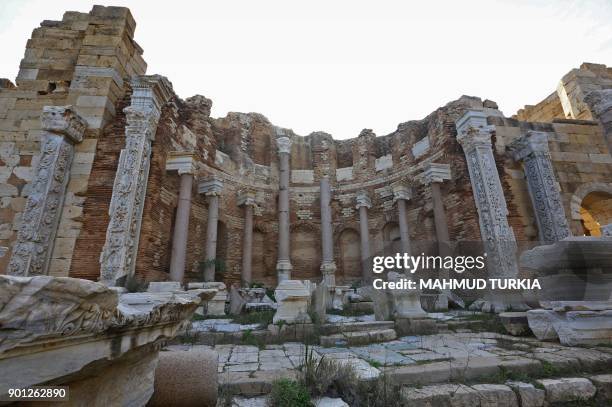 General view shows decorated columns in the ruins of the ancient Roman city of Leptis Magna in al-Khums, 130 kilometres east of the Libyan capital,...