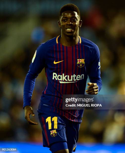 Barcelona's French forward Ousmane Dembele smiles during the Spanish Copa del Rey football match RC Celta de Vigo vs FC Barcelona at the Balaidos...