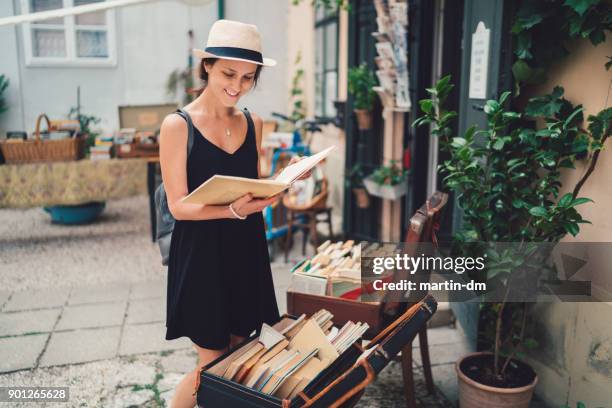 girl buying books in budapest - book shop exterior stock pictures, royalty-free photos & images