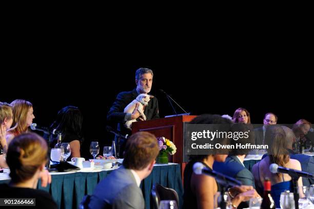 Bill Berloni holds Roxie while speaking at 83rd Annual Drama League Awards at Marriott Marquis on May 19, 2017 in New York City.