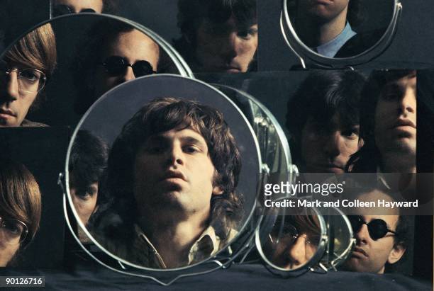 American rock band The Doors mirror their looks for a photoshoot, 1967. They are vocalist Jim Morrison, keyboardist Ray Manzarek, drummer John...
