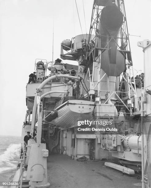View looking forward along the deck of the British Daring class destroyer HMS Daring , circa 1950.