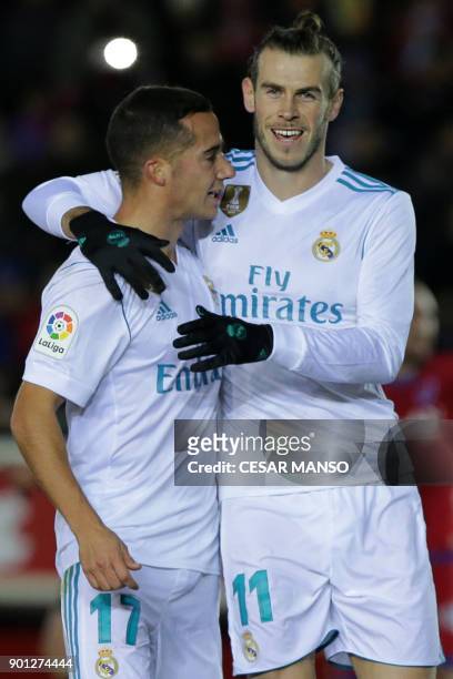 Real Madrid's Welsh forward Gareth Bale celebrates a goal with Real Madrid's Spanish midfielder Lucas Vazquez during the Spanish Copa del Rey round...