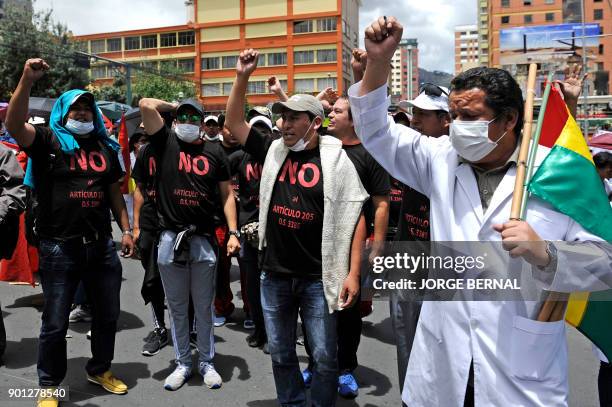 Medicine students and doctors take part in a protest against a new law that penalizes medical malpractice, near the Health Ministry in la Paz on...