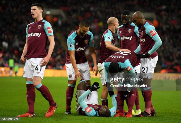 Pedro Obiang of West Ham United celebrates with teammates after scoring his sides first goal during the Premier League match between Tottenham...