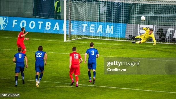 soccer player shooting penalty - soccer goalkeeper stock pictures, royalty-free photos & images