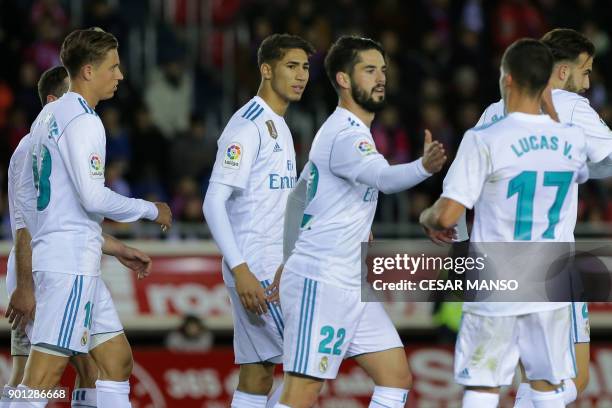 Real Madrid's Spanish midfielder Isco celebrates a goal during the Spanish Copa del Rey round of 16 first leg football match CD Numancia vs Real...