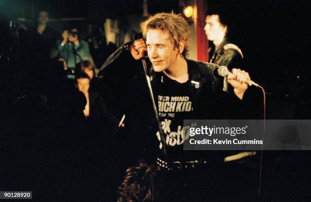 Singer Johnny Rotten performing with English punk band the Sex Pistols at Ivanhoe's, Huddersfield, on Christmas day 1977. On the right is bassist Sid...