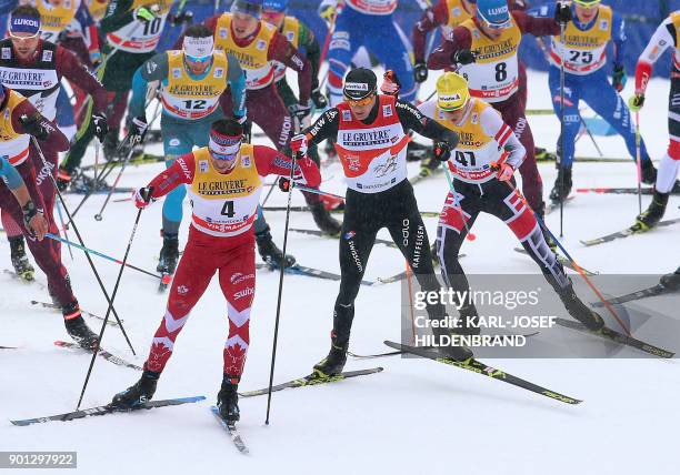 Canadian skier Alex Harvey compete in the men's 15 kilometer Mass Start free style race of the "Tour de Ski" Cross Country World Cup on January 4,...