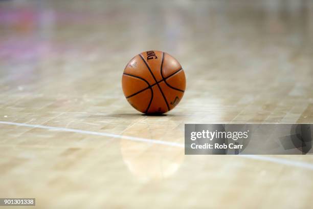 Basketball sits on the floor during a timeout in the Philadelphia 76ers and San Antonio Spurs game at Wells Fargo Center on January 3, 2018 in...