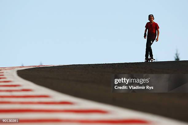 Teenage European Skateboard Champion Axel Cruysberghs skateboards down Eau Rouge following practice for the Belgian Grand Prix at the Circuit of Spa...