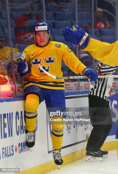 Oskar Steen of Sweden celebrates after scoring a goal against the United States in the third period during the IIHF World Junior Championship at...