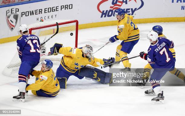 Brady Tkachuk of United States scores a goal past Filip Gustavsson of Sweden to cut the Sweden lead to 4-2 during the third period of play in the...